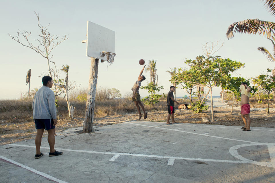 Soldiers play basketball on Nanshan Island (aka Lawak Island) another of the Spratly Islands, May 8, 2016.