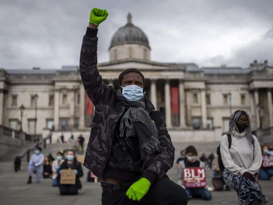 Protesters kneel in Trafalgar Square during a Black Lives Matter demonstration on 5 June in London: Justin Setterfield/Getty Images