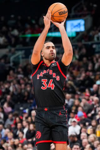 <p>Mark Blinch/Getty</p> Jontay Porter #34 of the Toronto Raptors shoots against the Houston Rockets during the first half of their basketball game at the Scotiabank Arena on February 9, 2024