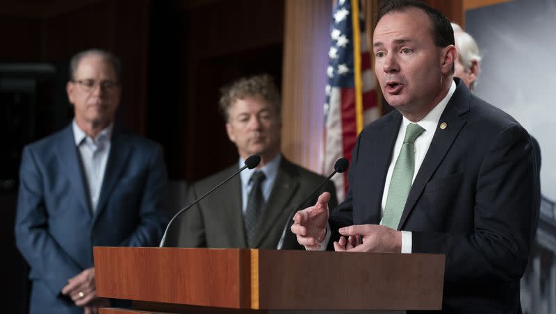 Sen. Mike Lee, R-Utah, from right, with Sens. Rand Paul, R-Ky., Mike Braun, R-Ind., talks about debt ceiling during a news conference on Capitol Hill in Washington on Jan. 25, 2023.