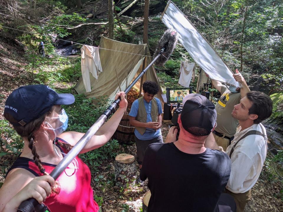 Actor Caleb Baumann, center, who plays Stryker, in a scene with actor Zane Stephens (Joshua, in white shirt and suspenders) in filming of "The Skeleton's Compass" in Georgia during the summer of 2020. The film is now streaming on sites including Apple TV, Amazon Prime, Vudu and more. (Photo by Isaac Alongi)