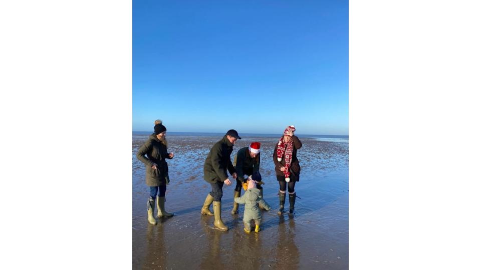 Beatrice, Edoardo, Jack and Eugenie playing on the beach with August and Sienna at Christmas 2022