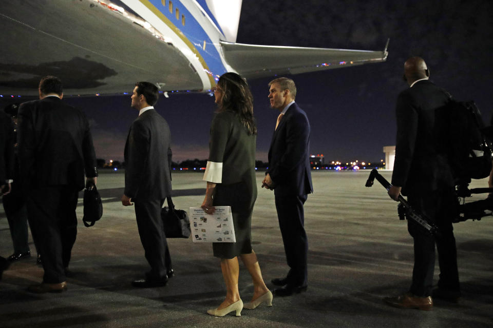 Rep. Jim Jordan, R-Ohio, center, boards Air Force One en route to Andrews Air Force Base, Md., after attending President Donald Trump's speech at the Israeli American Council National Summit in Hollywood, Fla., Saturday, Dec. 7, 2019. (AP Photo/Patrick Semansky)