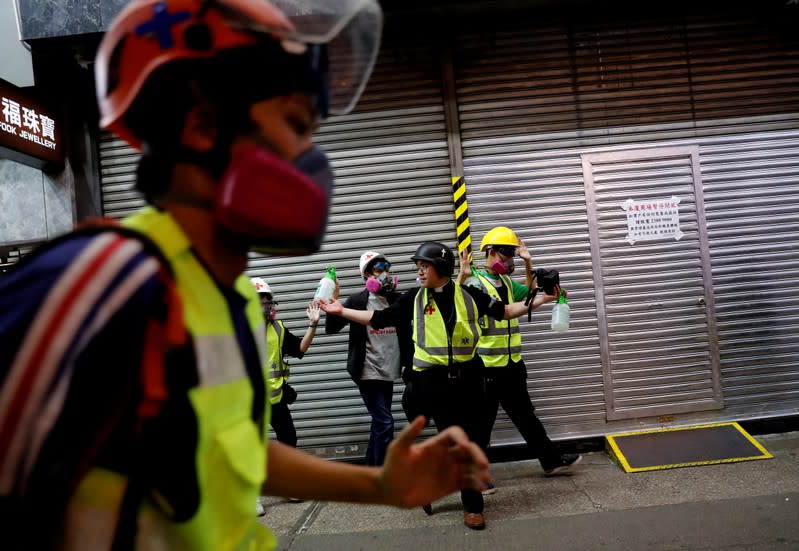 The Wider Image: Sermons with saline: Hong Kong pastor offers aid and prayers