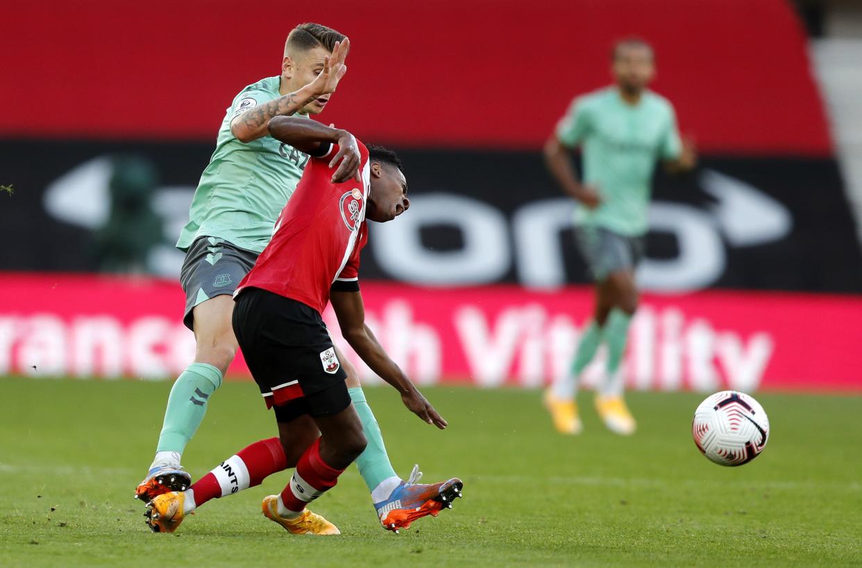 Lucas Digne’s studs raked the back of Kyle Walker-Peters’ leg (EPA)