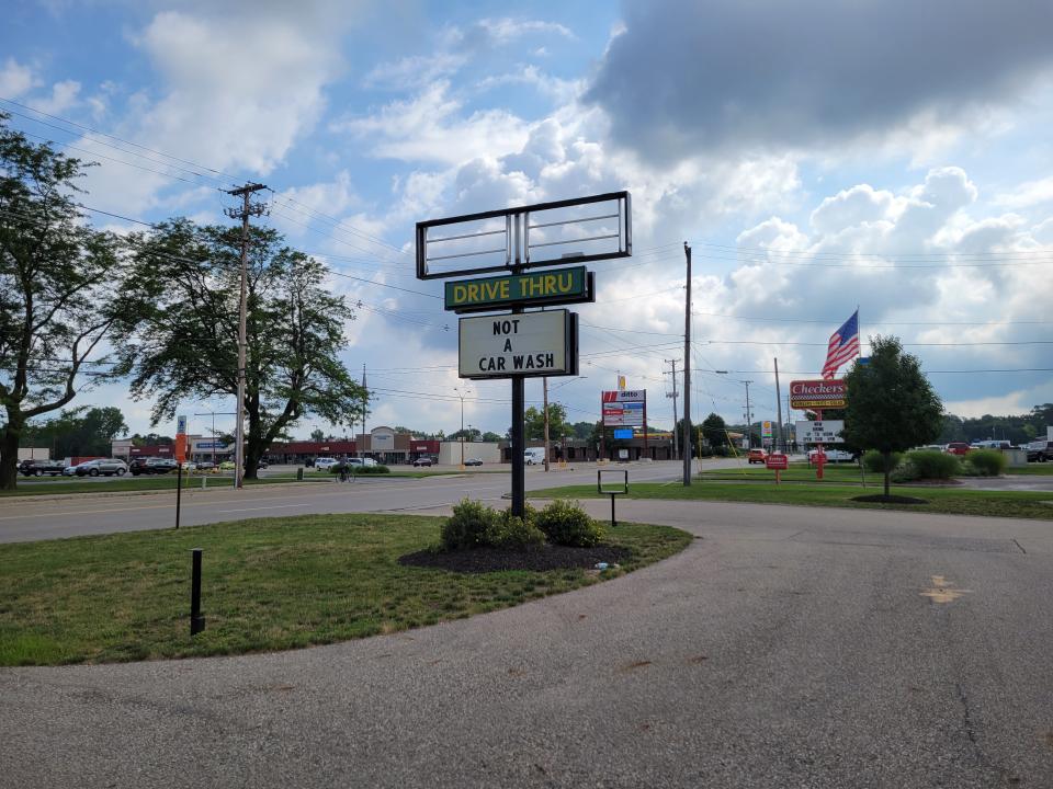 Signage announces the new business at 544 E. Eighth St. is "not a car wash."