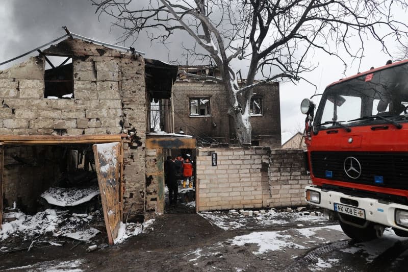 Firefighters deal with the aftermath of the Russian drone attack in the Nemyshlianskyi district. -/Ukrinform/dpa