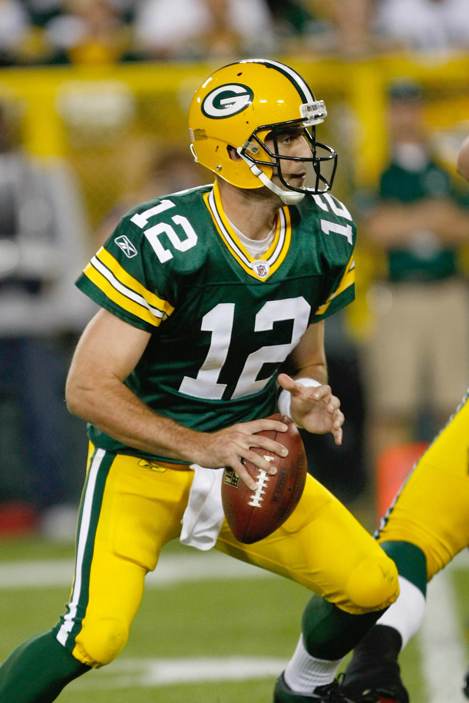 GREEN BAY, WI - SEPTEMBER 8: Aaron Rogers #12 of the Green Bay Packers runs with the football during the game against the New Orleans Saints at Lambeau Field on September 8, 2011 in Green Bay, Wisconsin. The Saints defeated the Packers 42-34. (Photo by Scott Boehm/Getty Images)