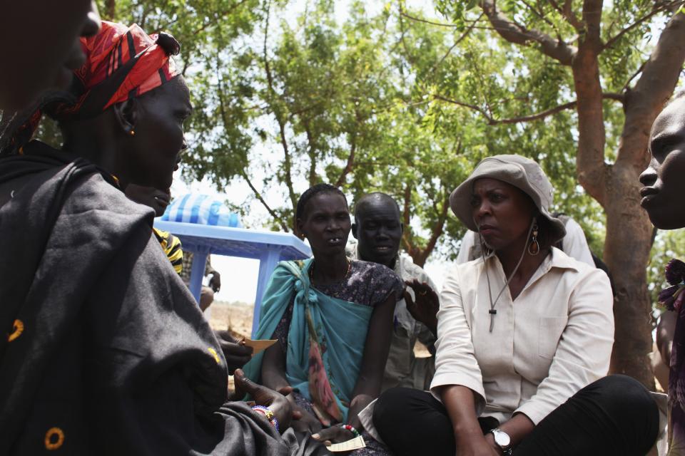 Ertharin Cousin, United Nations World Food Programe Executive Director, speaks with South Sudanese women in Nyal