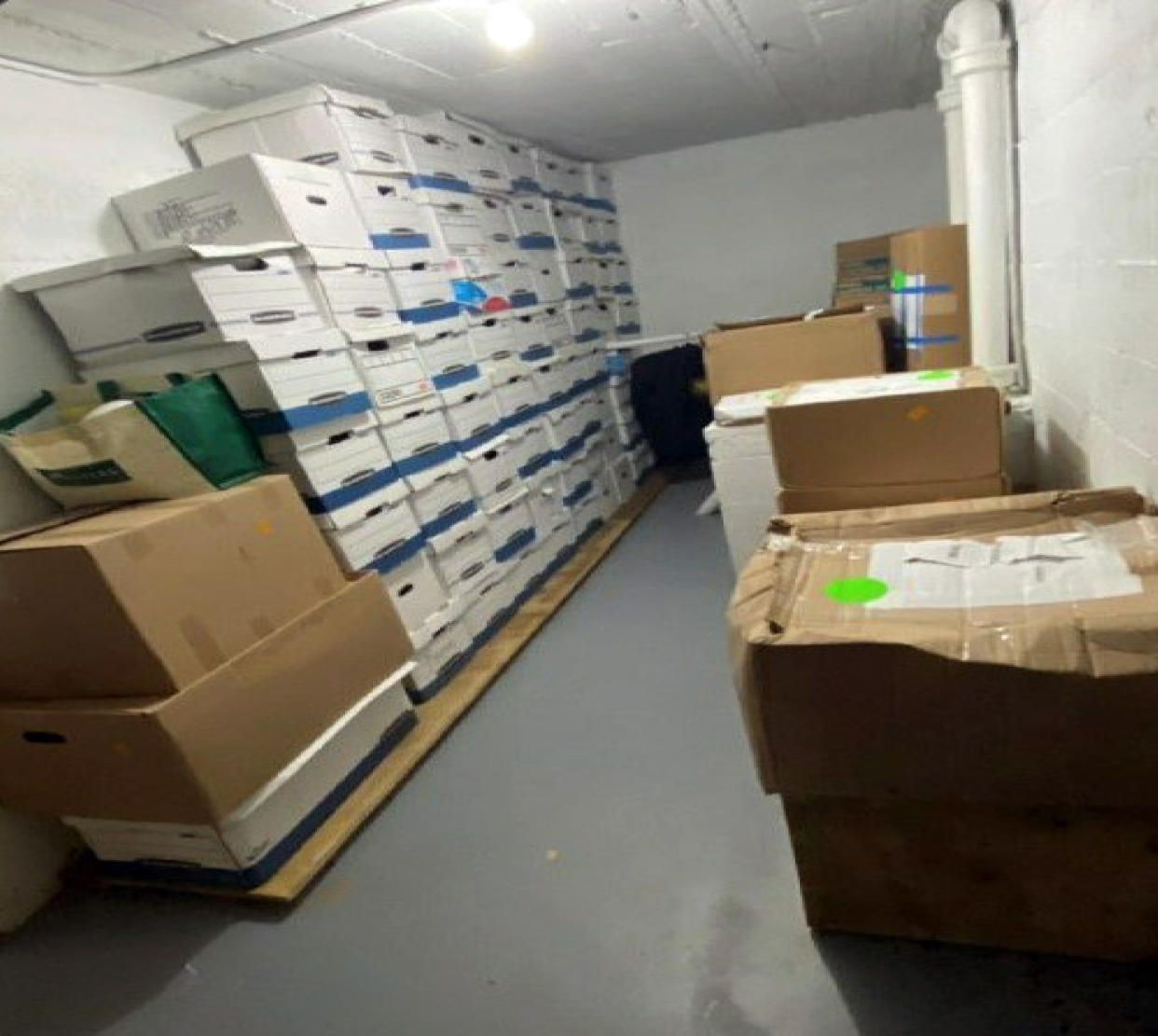 This image, included in the indictment, shows boxes of records piled in a stack eight boxes wide and seven boxes deep.