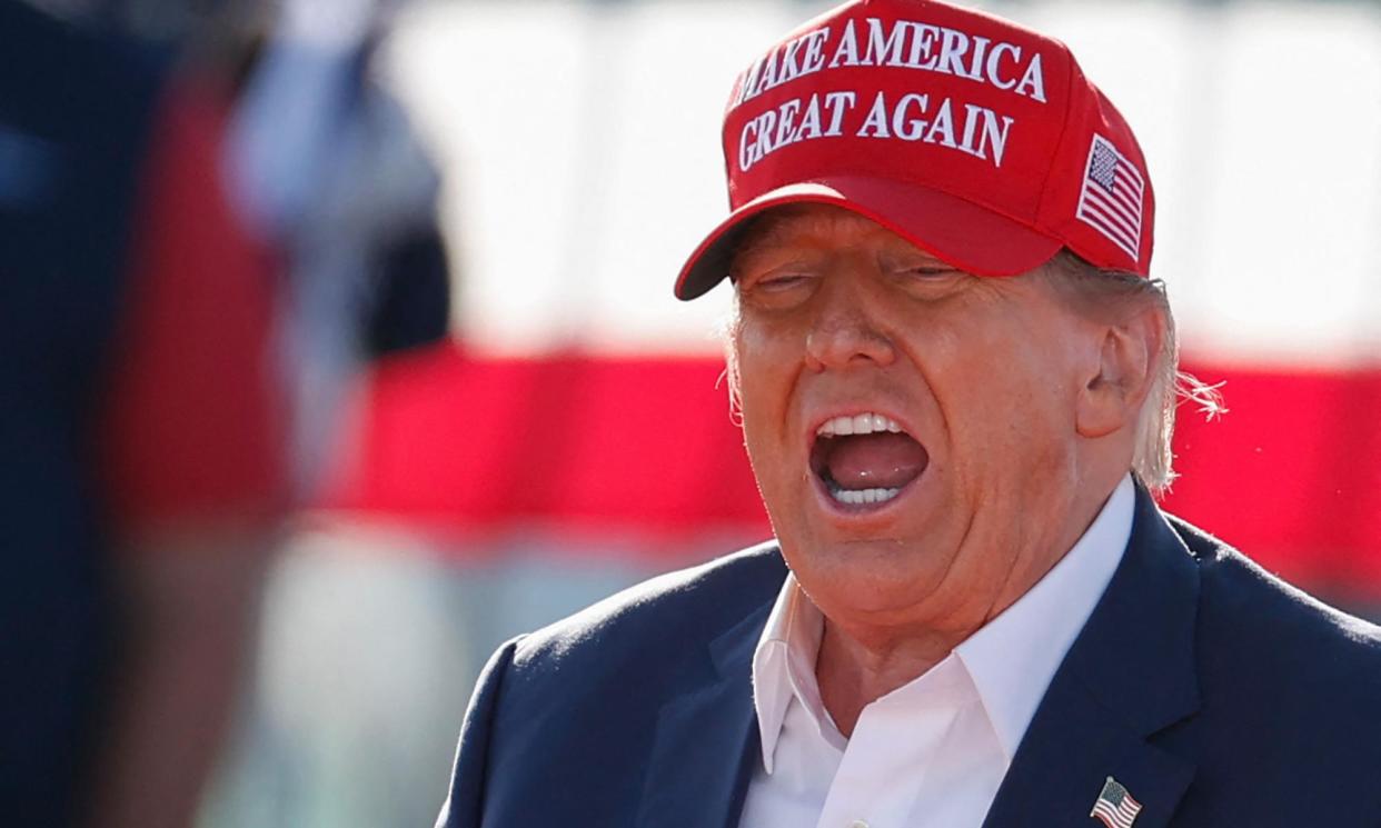 <span>Donald Trump speaks during a rally in Vandalia, Ohio, on 16 March, at which he predicted there would be a ‘bloodbath’ if he loses the election.</span><span>Photograph: Kamil Krzaczyński/AFP/Getty Images</span>