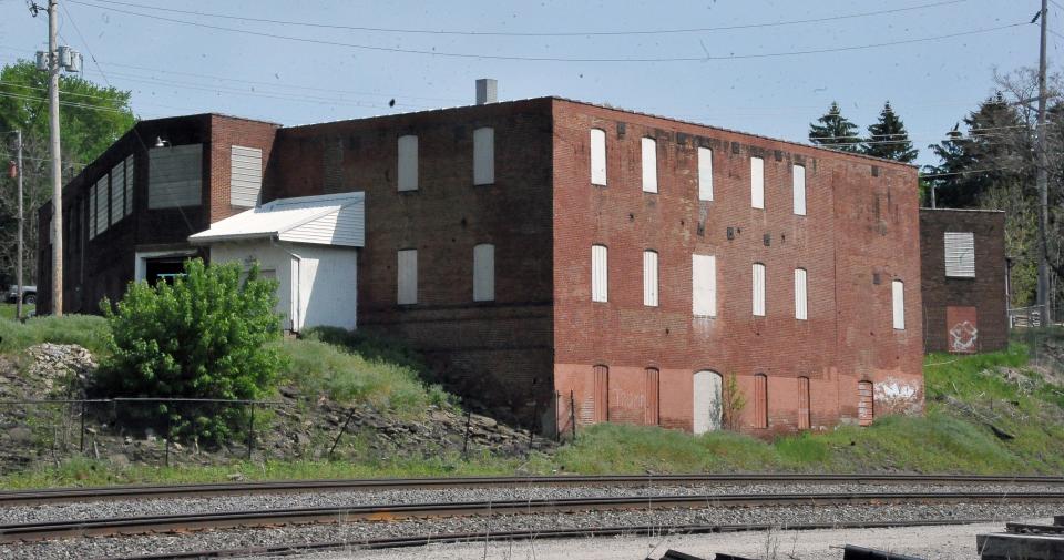 The large multi-story Friendly Wholesale building on Cushman Street as seen recently from the railroad tracks in Wooster. The new owners of Friendly Wholesale refer to it as the Main Building. It is one of four buildings on the Friendly Wholesale campus.
