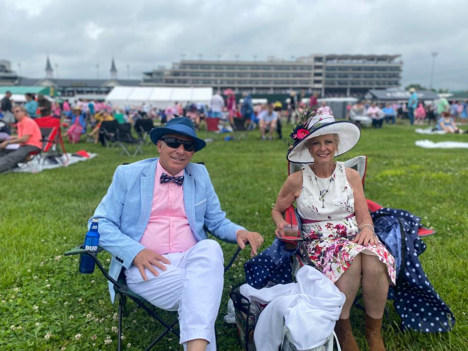 Bill and Karen Buxton, of Brighton, Colorado, in the infield on Oaks Day. (Josh Wood / Courier Journal)