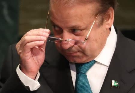 Prime Minister Nawaz Sharif of Pakistan removes his eyeglasses after addressing the United Nations General Assembly in the Manhattan borough of New York, U.S., September 21, 2016. REUTERS/Carlo Allegri