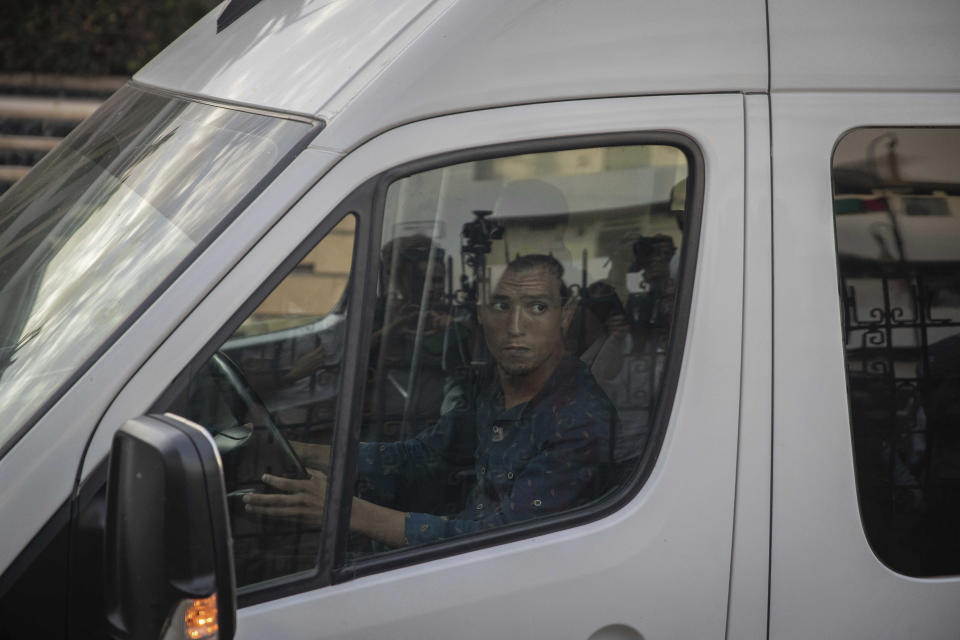 A police van prepares to drive journalist Hajar Rissouni away from court after she was sentenced to one year in prison on accusations of her undergoing an illegal abortion, in Rabat, Morocco, Monday, Sept. 30, 2019. The 28-year old Moroccan journalist Hajar Raissouni was sentenced to one year in prison, Monday, while her fiancé also received a one-year sentence and the doctor accused of terminating the pregnancy was sentenced to two years in jail and suspended from practicing. (AP Photo/Mosa'ab Elshamy)