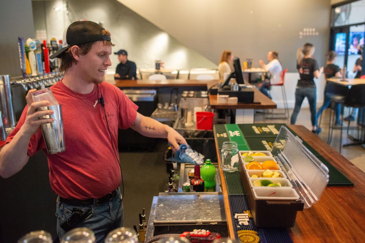 A Kansas Avenue Traffic Jam is mixed Tuesday evening by bartender Isaac Bird at the Pennant, 915 S. Kansas Ave. The traffic jam is among five mixed drinks being highlighted by The Capital-Journal in recognition of National Cocktail Day, which is Thursday.