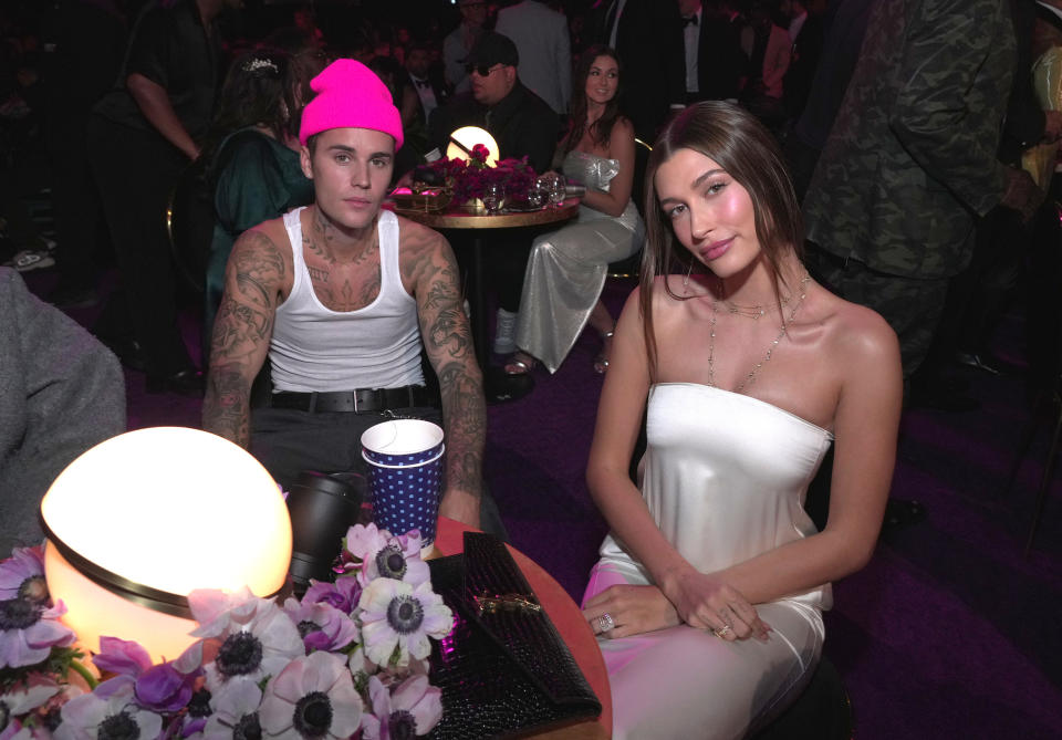 LAS VEGAS, NEVADA - APRIL 03: (L-R) Justin Bieber and Hailey Bieber attend the 64th Annual GRAMMY Awards at MGM Grand Garden Arena on April 03, 2022 in Las Vegas, Nevada. (Photo by Kevin Mazur/Getty Images for The Recording Academy)