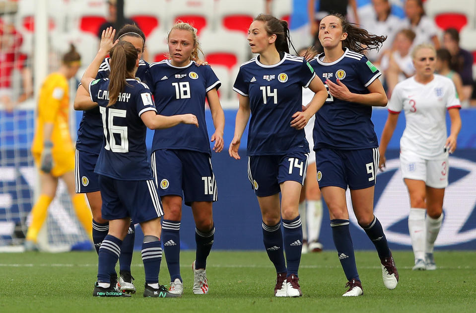 NICE, FRANCE - JUNE 09: Claire Emslie of Scotland celebrates with teammates after scoring her team's first goal during the 2019 FIFA Women's World Cup France group D match between England and Scotland at Stade de Nice on June 09, 2019 in Nice, France. (Photo by Richard Heathcote/Getty Images)