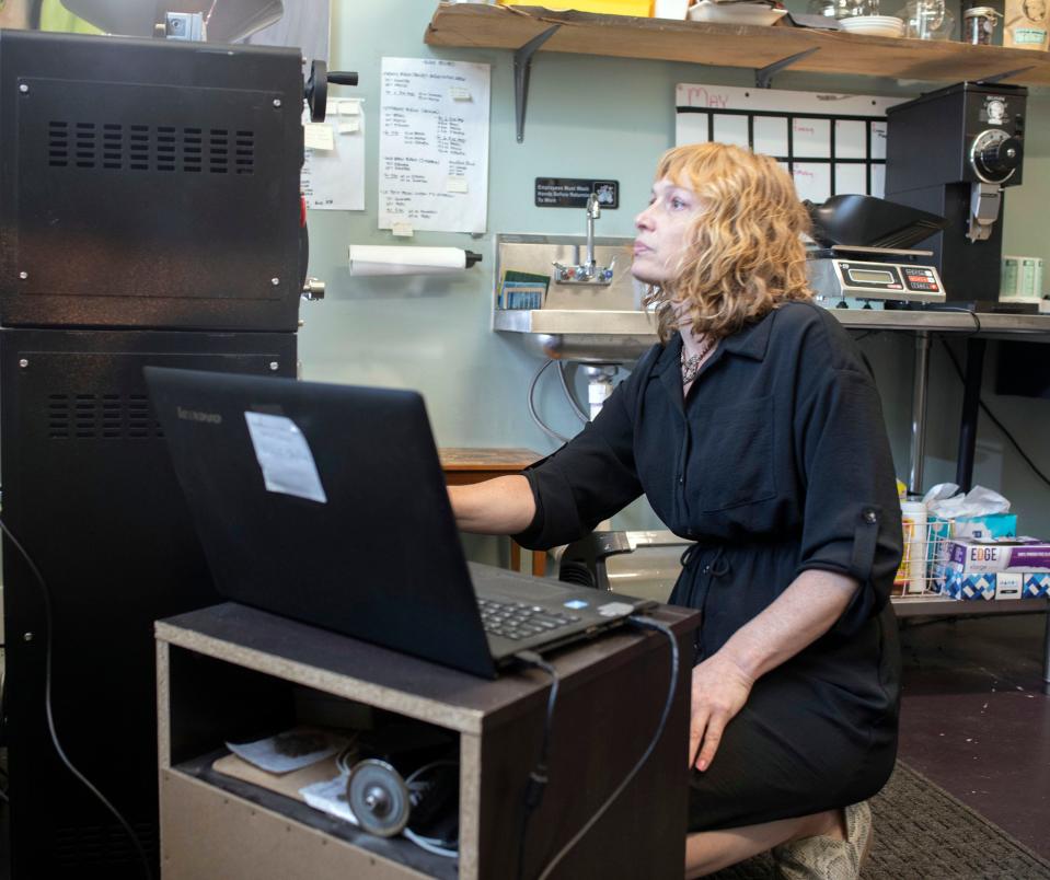 Summer Sevi, the owner of Alla Prima Coffee, monitors the coffee roasting process while creating one of her signature blends on Thursday, May 25, 2023. Sevis is preparing to open a full-service coffee shop in downtown Pensacola in early to mid-June.