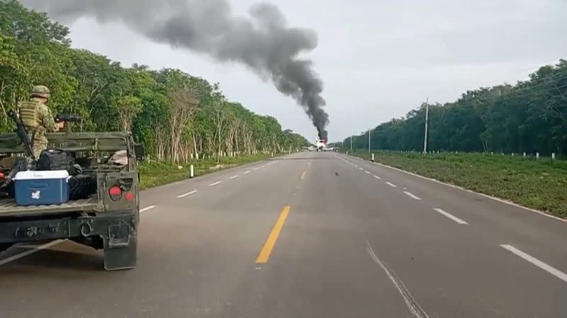 Video grab of a plane suspected of carrying drugs that was reportedly set alight after allegedly being intercepted by soldiers on Federal Highway 184 in Quintana Roo state, Mexico