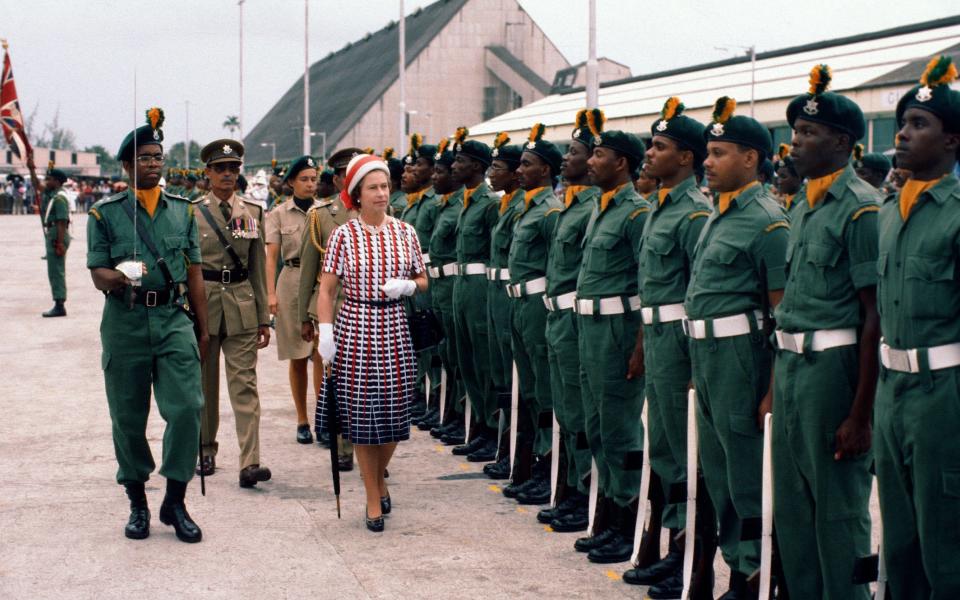 The Queen inspects a guard of honour in Barbados in 1977 - Anwar Hussein/Getty 