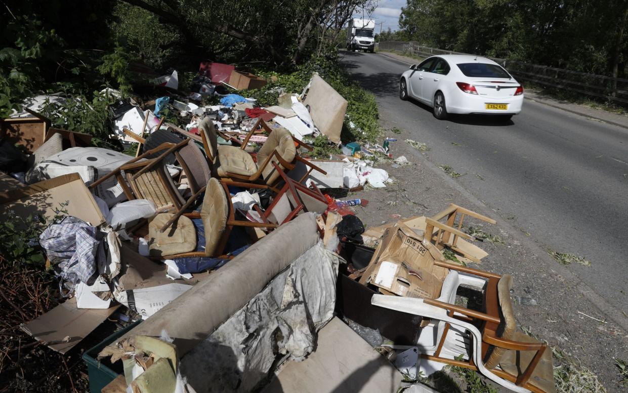 Local authorities dealt with 1.13 million cases of rubbish dumped on highways and in beauty spots in 2020-21 - Adrian Dennis/AFP via Getty Images
