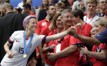 United States' Megan Rapinoe celebrates with fans after the Women's World Cup final soccer match between US and The Netherlands at the Stade de Lyon in Decines, outside Lyon, France, Sunday, July 7, 2019. (AP Photo/Alessandra Tarantino)