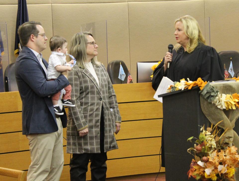 Monroe County Probate Judge Cheryl E. Lohmeyer discussed the adoption process with Nicholas and Julie Jacobs. The couple adopted six-month-old Asher James Jacobs on Tuesday, Nov. 22, Monroe County Adoption Day 2022.