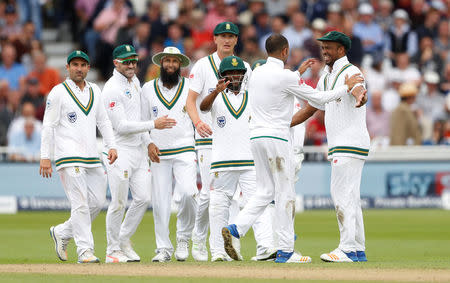 Cricket - England vs South Africa - Second Test - Nottingham, Britain - July 15, 2017 South Africa's Keshav Maharaj celebrates with team mates after taking the wicket of England's Liam Dawson Action Images via Reuters/Carl Recine