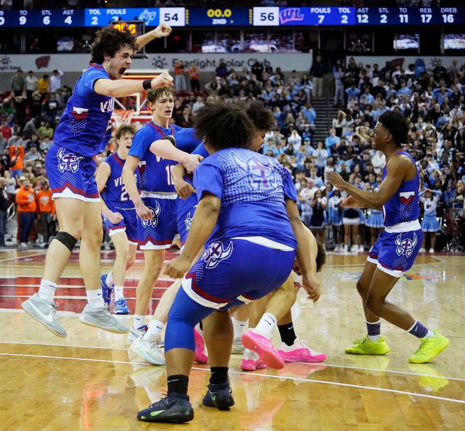 Wisconsin Lutheran celebrate their victory over Nicolet in the WIAA Division 2 boys basketball state semifinal game on Friday March 15, 2024 at the Kohl Center in Madison, Wis.