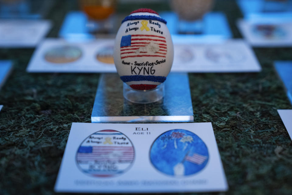 Eggs designed by children of members of the military adorn the East Colonnade of the White House ahead of the White House Easter Egg Roll, Thursday, March 28, 2024, in Washington. (AP Photo/Evan Vucci)