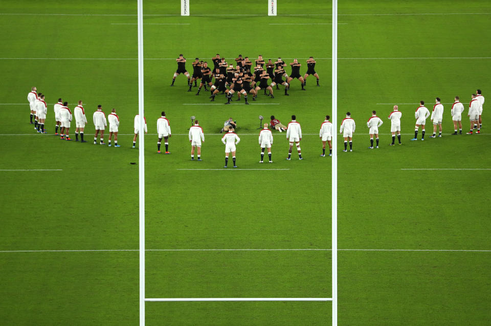 YOKOHAMA, JAPAN - OCTOBER 26: England players look on while New Zealand players perform a haka during the Rugby World Cup 2019 Semi-Final match between England and New Zealand at International Stadium Yokohama on October 26, 2019 in Yokohama, Kanagawa, Japan. (Photo by Dan Mullan/Getty Images)