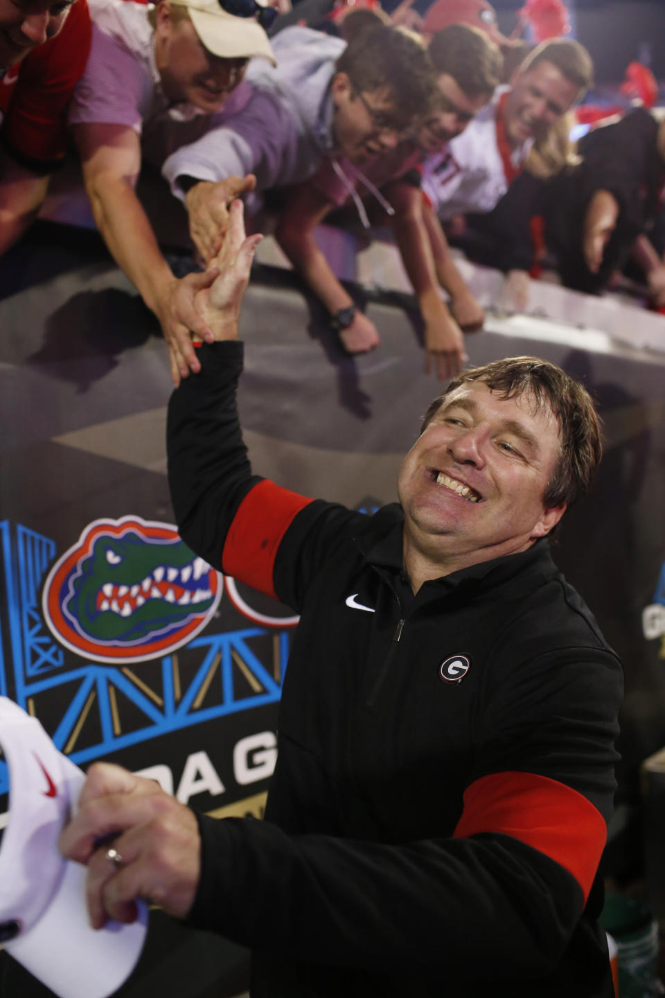 Georgia coach Kirby Smart celebrates with fans after the team's win over Florida in an NCAA college football game Saturday, Nov. 2, 2019, in Jacksonville, Fla. (Joshua L. Jones/Athens Banner-Herald via AP)