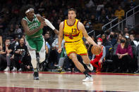 Atlanta Hawks guard Bogdan Bogdanovic (13) drives past Boston Celtics center Robert Williams III (44) during the second half of an NBA basketball game Friday, Jan. 28, 2022, in Atlanta. (AP Photo/Hakim Wright Sr.)