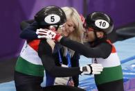 Short Track Speed Skating Events - Pyeongchang 2018 Winter Olympics - Men's 5000m Relay Final - Gangneung Ice Arena - Gangneung, South Korea - February 22, 2018 - Shaoang Liu of Hungary and Shaolin Sandor Liu of Hungary celebrate with Elise Christie of Britain. REUTERS/John Sibley