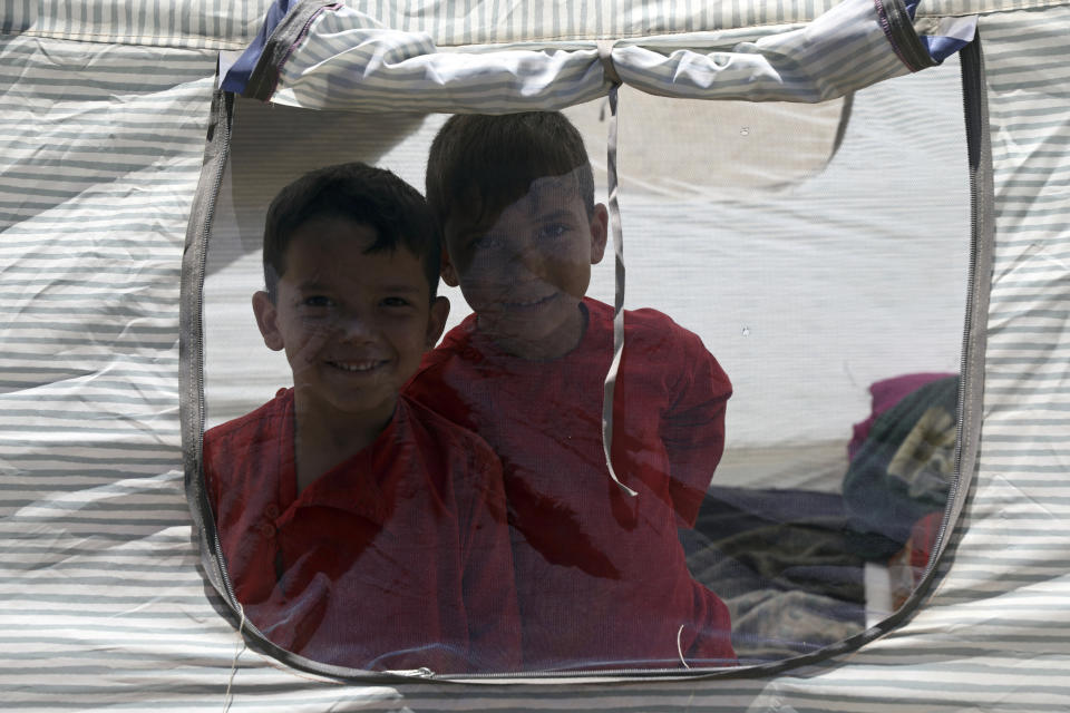 Internally displaced Afghans from northern provinces, who fled their home due to fighting between the Taliban and Afghan security personnel, take refuge in a public park in Kabul, Afghanistan, Tuesday, Aug. 10, 2021. (AP Photo/Rahmat Gul)