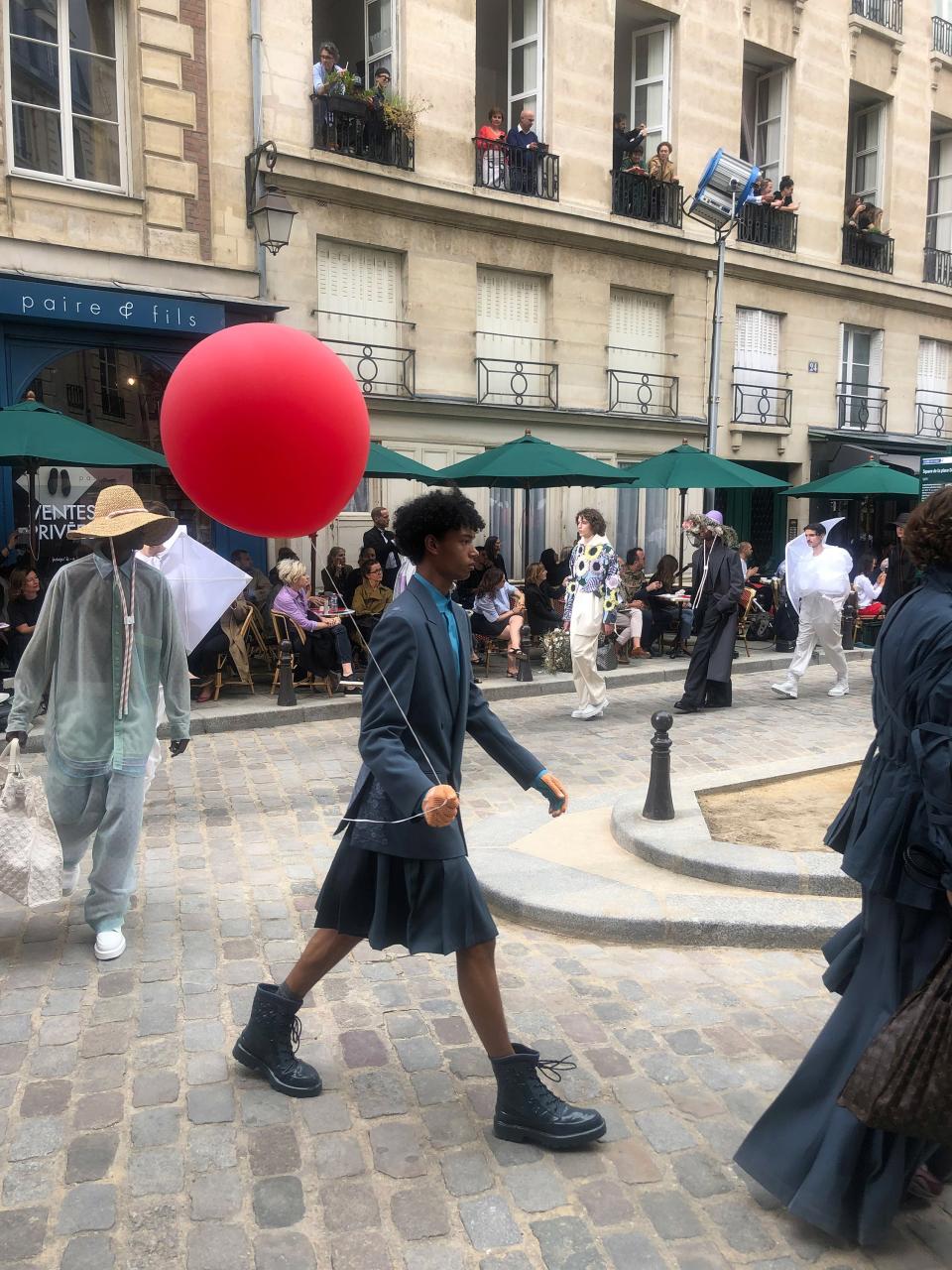 Virgil’s army weaving through the streets of Place Dauphine for the finale of Louis Vuitton.