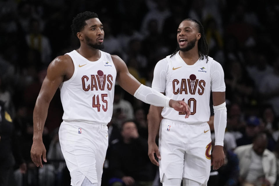 Cleveland Cavaliers' Darius Garland (10) celebrates with Donovan Mitchell (45) after Mitchell hit a game-winning three-point shot during the second half of an NBA basketball game against the Brooklyn Nets, Wednesday, Oct. 25, 2023, in New York. The Cavaliers won 114-113. (AP Photo/Frank Franklin II)