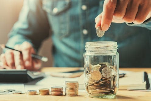 <span class="caption">The incoming government will have to keep its promises on tax.</span> <span class="attribution"><a class="link " href="https://www.shutterstock.com/image-photo/businessman-holding-coins-putting-glass-concept-793237669" rel="nofollow noopener" target="_blank" data-ylk="slk:lovelyday12;elm:context_link;itc:0;sec:content-canvas">lovelyday12</a></span>