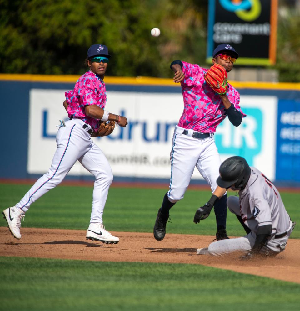 Blue Wahoos' second baseman Jose Devers tries for the double play during play against the Birmingham Barons Sunday, April 23, 2023 at Blue Wahoos Stadium.