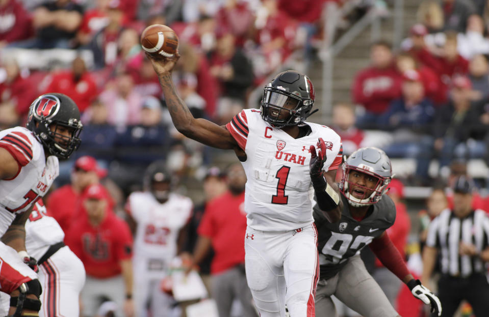 FILE - In this Sept. 29, 2018, file photo, Utah quarterback Tyler Huntley (1) throws a pass in front of Washington State defensive end Will Rodgers III (92) during the second half of an NCAA college football game in Pullman, Wash. Utah, which plays Stanford this week, is averaging just 16 points per game against FBC competition as Huntley hasn't thrown a TD pass since a season-opening win against FCS-level Weber State. (AP Photo/Young Kwak, File)