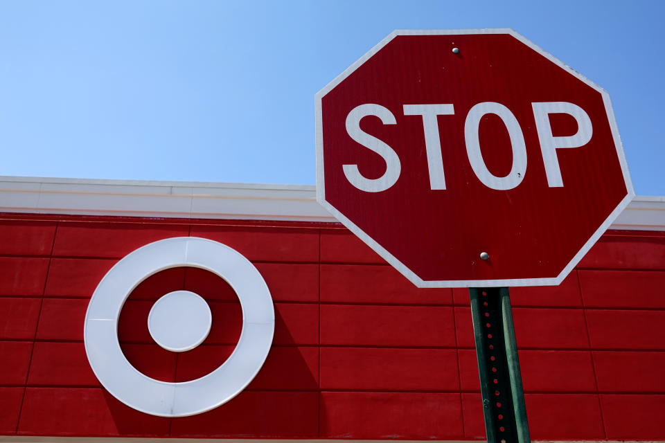 MIAMI, FLORIDA - MAY 18: A sign hangs over the entrance of a Target store on May 18, 2022 in Miami, Florida.  The retail store reported a 52% drop in profit for the first quarter, missing Wall Street's forecasts. The company blamed higher expenses due to continued supply chain disruptions as well as the high inflation rate. (Photo by Joe Raedle/Getty Images)