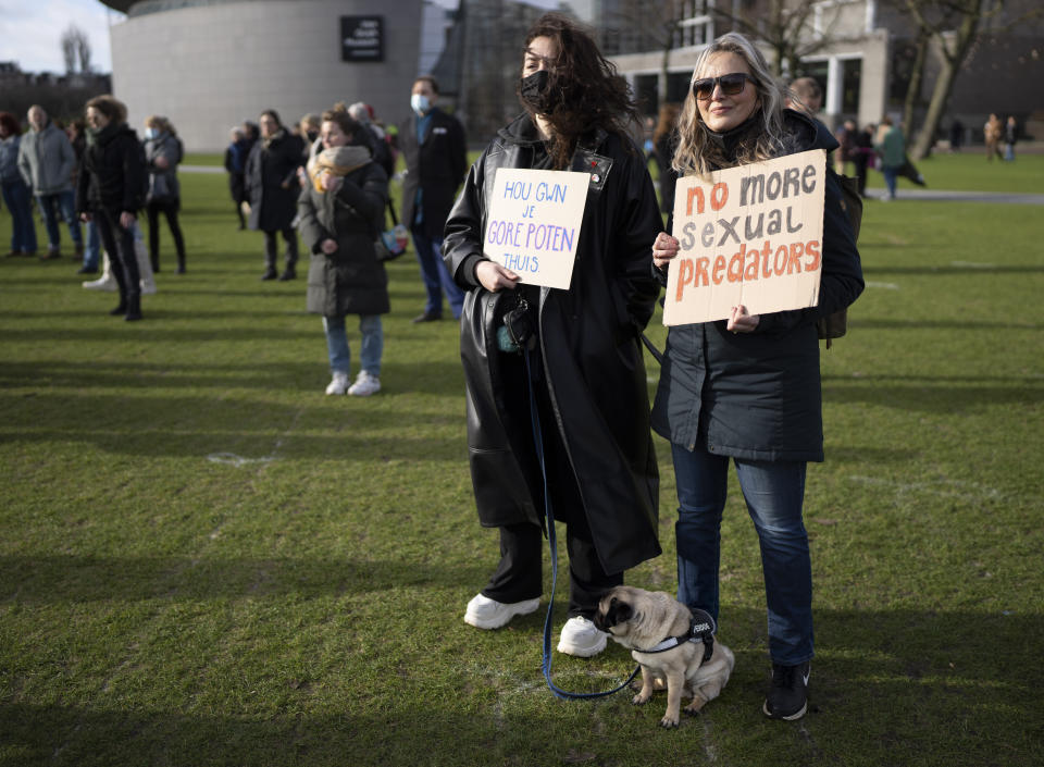 Hundreds of people protested in Amsterdam, Netherlands, Saturday, Jan. 29, 2022, in a #MeToo demonstration sparked by allegations of sexual improprieties linked to a popular Dutch TV talent show. The demonstration on Amsterdam's Museumplein square was organized following reports of inappropriate sexual behavior, ranging from WhatsApp messages to an allegation of rape, linked to "The Voice of Holland." (AP Photo/Peter Dejong)