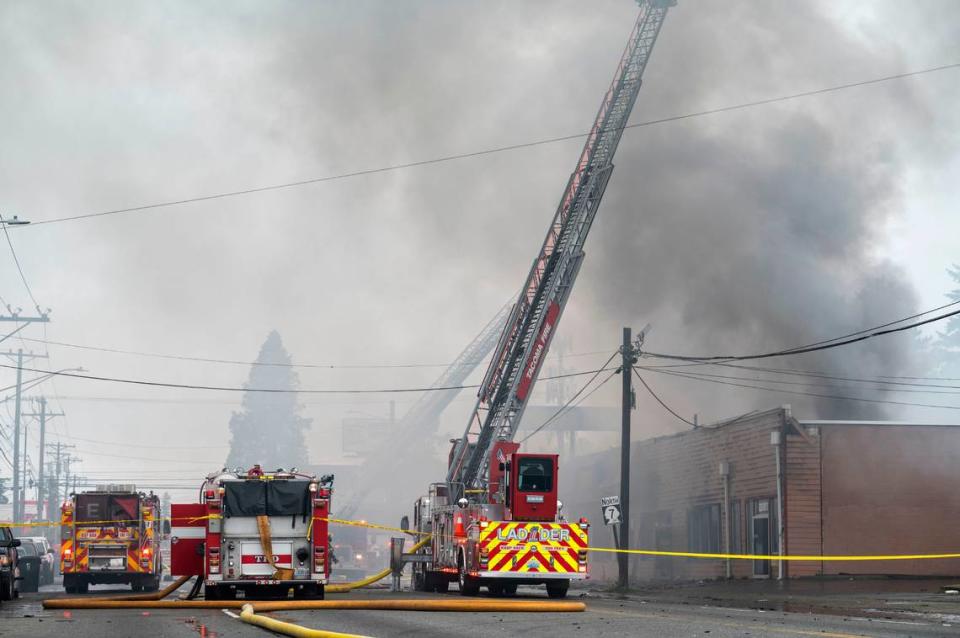 Tacoma firefighters battle a two-alarm fire at Buddy’s Furniture store at 8219 Pacific Avenue in Tacoma, Wash. on Tuesday, May 2, 2023.