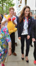 LONDON, ENGLAND - JULY 31: Prince Harry holds a Kangaroo given to him by Australian athletes as he walks with Catherine, Duchess of Cambridge during a visit to the Team GB accommodation flats in the Athletes Village at the Olympic Park in Stratford on Day 4 of the London 2012 Olympic Games on July 31, 2012 in London, England. (Photo by John Stillwell - WPA Pool/Getty Images)