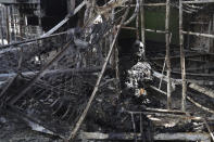 EDS NOTE: GRAPHIC CONTENT - A burned out body of Ukrainian military prisoner is seen in destroyed barrack at a prison in Olenivka, in an area controlled by Russian-backed separatist forces, eastern Ukraine, Friday, July 29, 2022. Russia and Ukraine accused each other Friday of shelling the prison in Olenivka in a separatist region of eastern Ukraine, an attack that reportedly killed dozens of Ukrainian military prisoners who were captured after the fall of a southern port city of Mariupol in May. (AP Photo)