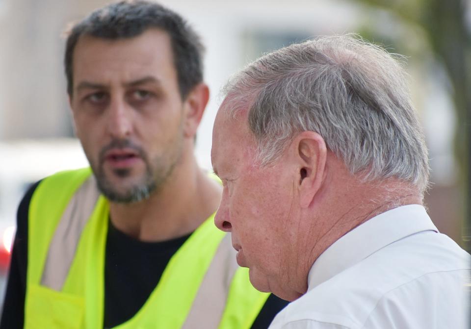 Mayor Paul Coogan talks with Shaun Rebello on Columbia street.