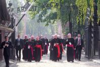 Cardinals and bishops walk through the gate of the former Nazi German death camp of Auschwitz in Oswiecim, Poland, Friday, July 29, 2016. Pope Francis paid a somber visit to the Nazi German death camp of Auschwitz-Birkenau Friday, becoming the third consecutive pontiff to make the pilgrimage to the place where Adolf Hitler’s forces killed more than 1 million people, most of them Jews. (AP Photo/Czarek Sokolowski)