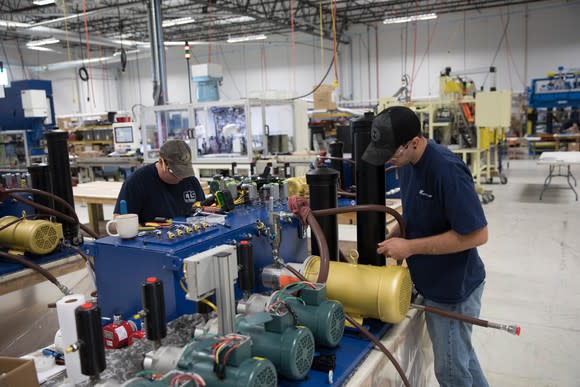 Manufacturing employees working at a U.S. Apple supplier