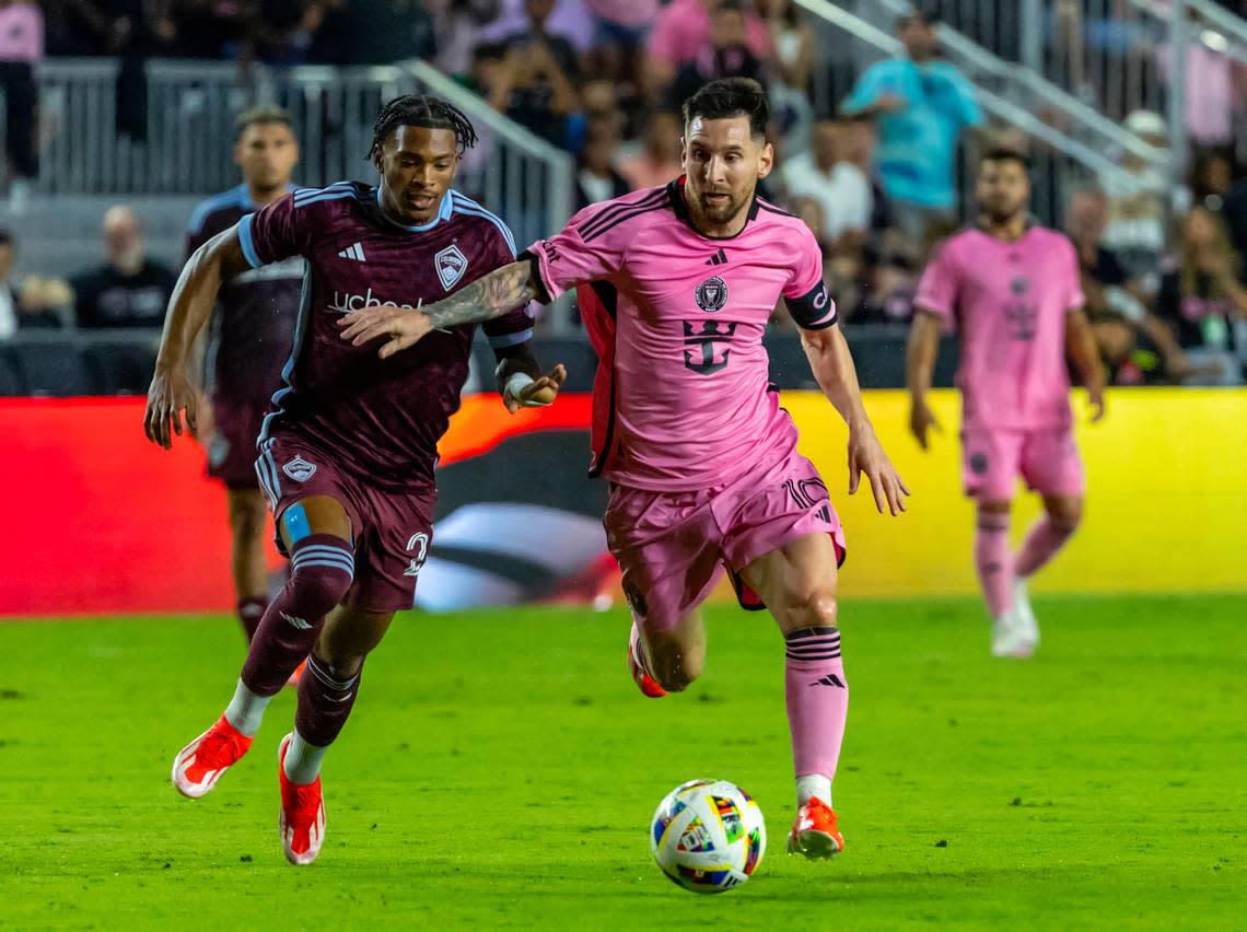 Inter Miami forward Lionel Messi (10) controls the ball in the as Colorado Rapids forward Kimani Stewart-Baynes (27) defends second half of an MLS match at Chase Stadium on Saturday, April 6, 2024, in Fort Lauderdale, Fla.